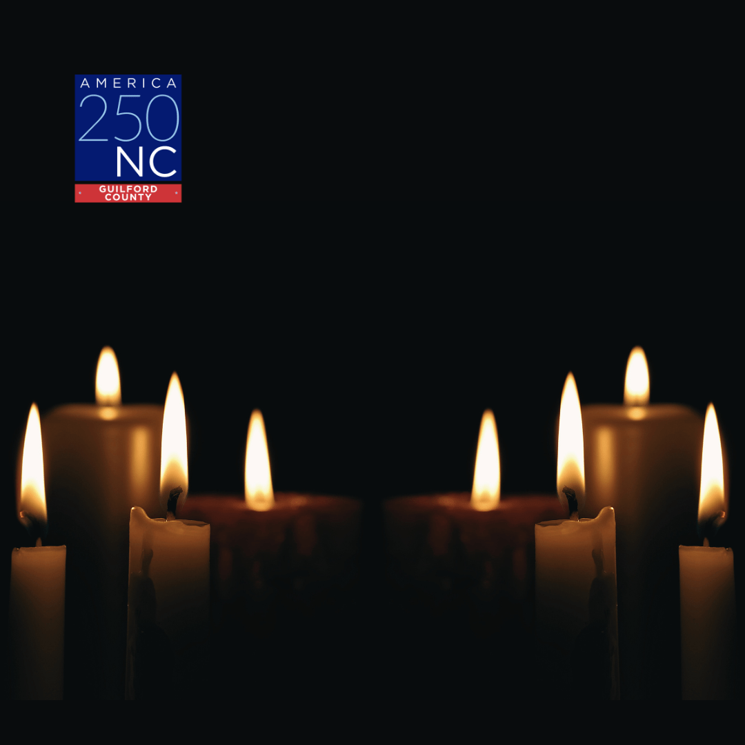 Candles burning on a black background